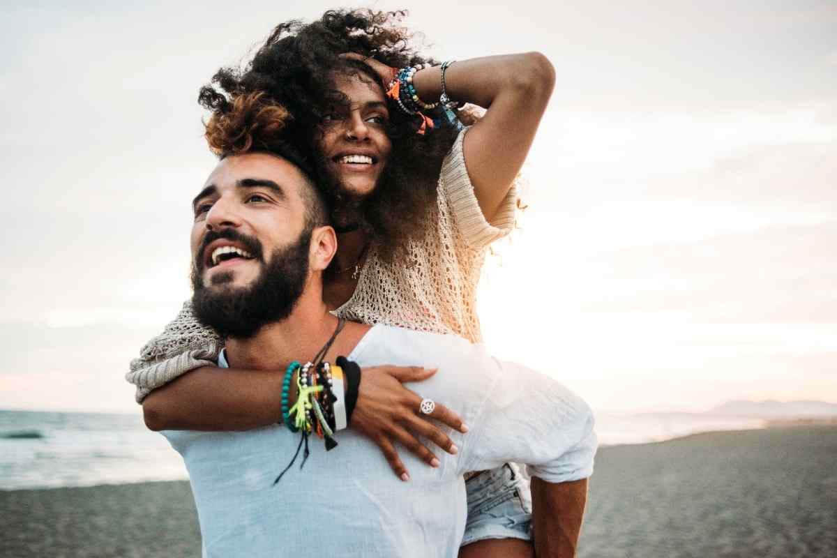 Couple laughing together, relaxed and enjoying easy conversation