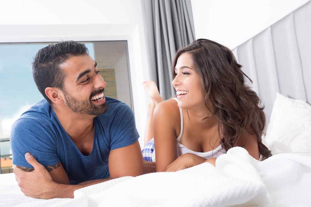 A couple sharing easy, unhurried presence with each other, comfortable in the quiet