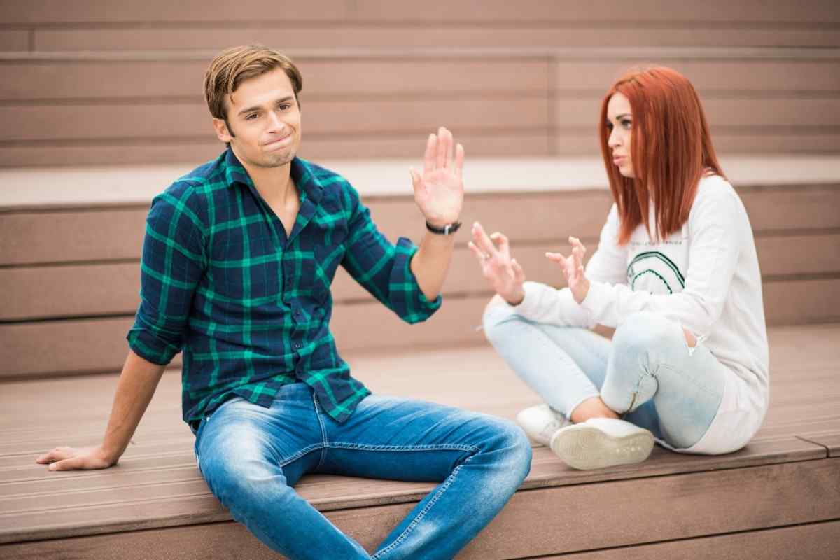 Gemini man checking his phone with a bored or distracted expression