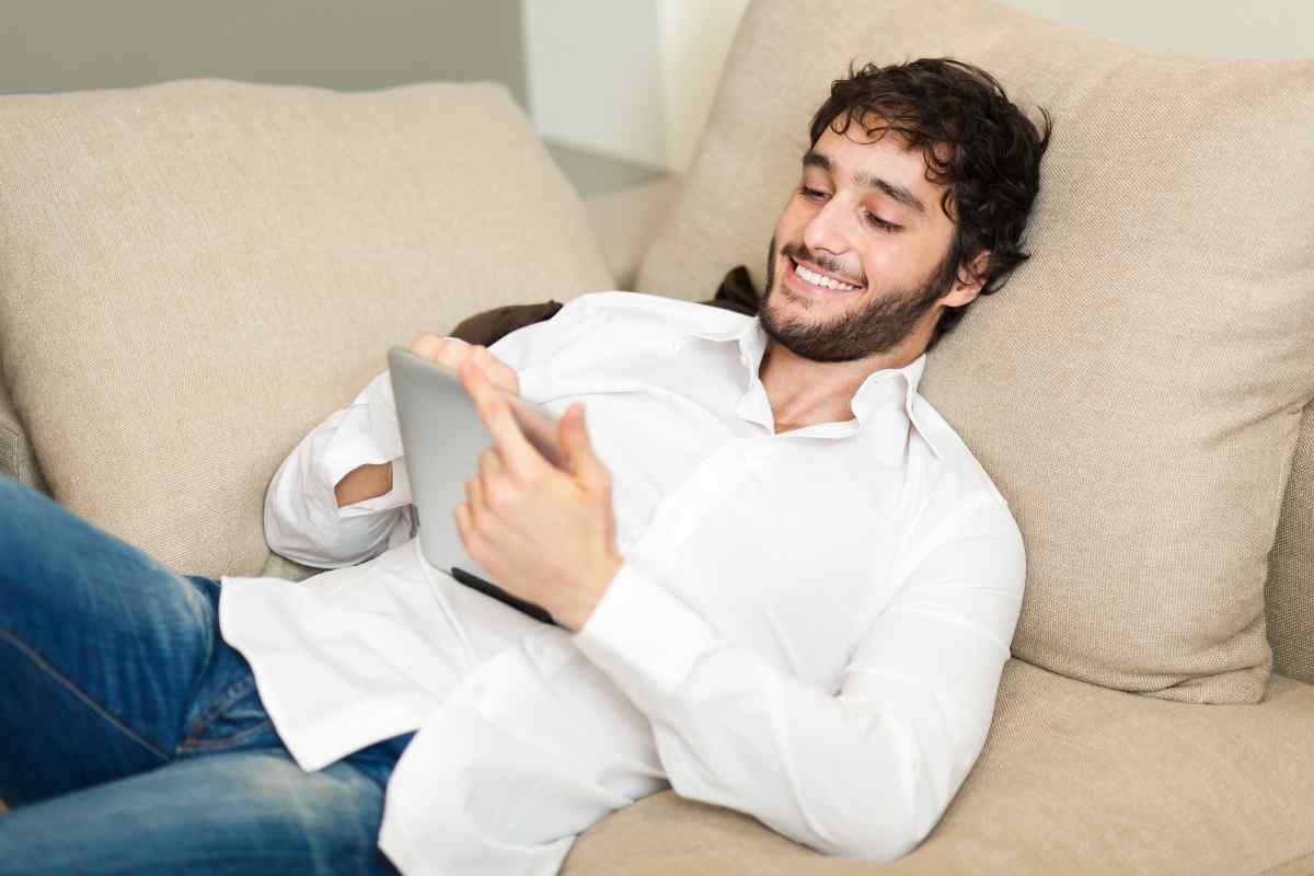 A couple together in a soft, unhurried moment, the warmth between them easy and genuine, illustrating the kind of emotional climate a Cancer man needs to feel fully at ease