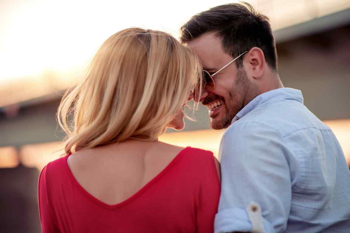 A couple in a soft, close moment at home, the atmosphere warm and unhurried, capturing the emotional climate a Cancer woman needs to feel genuinely at ease in intimate settings
