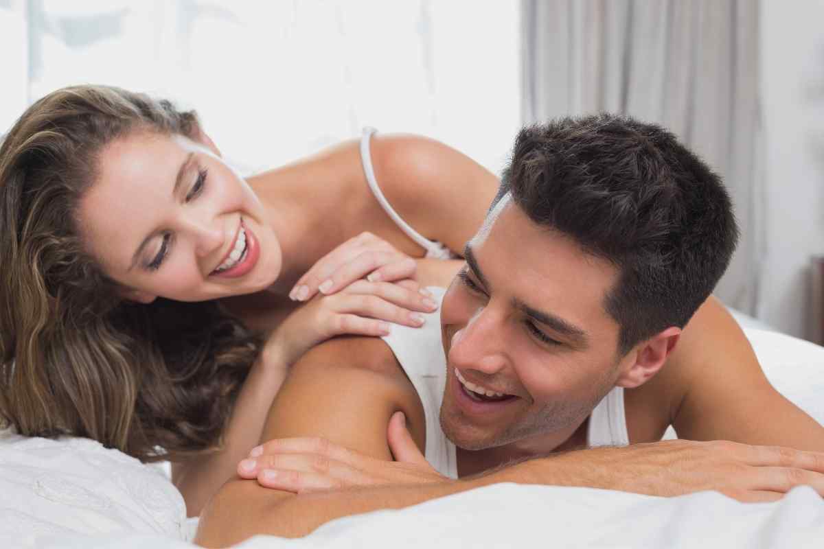 A woman feeling genuinely appreciated and at ease in an intimate, softly lit setting