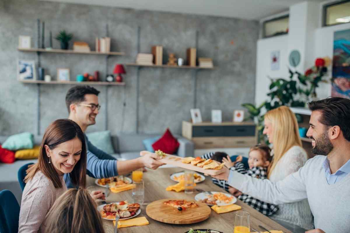 Sagittarius man being warm and engaged with his family, representing his generosity and lightness as a partner in everyday life