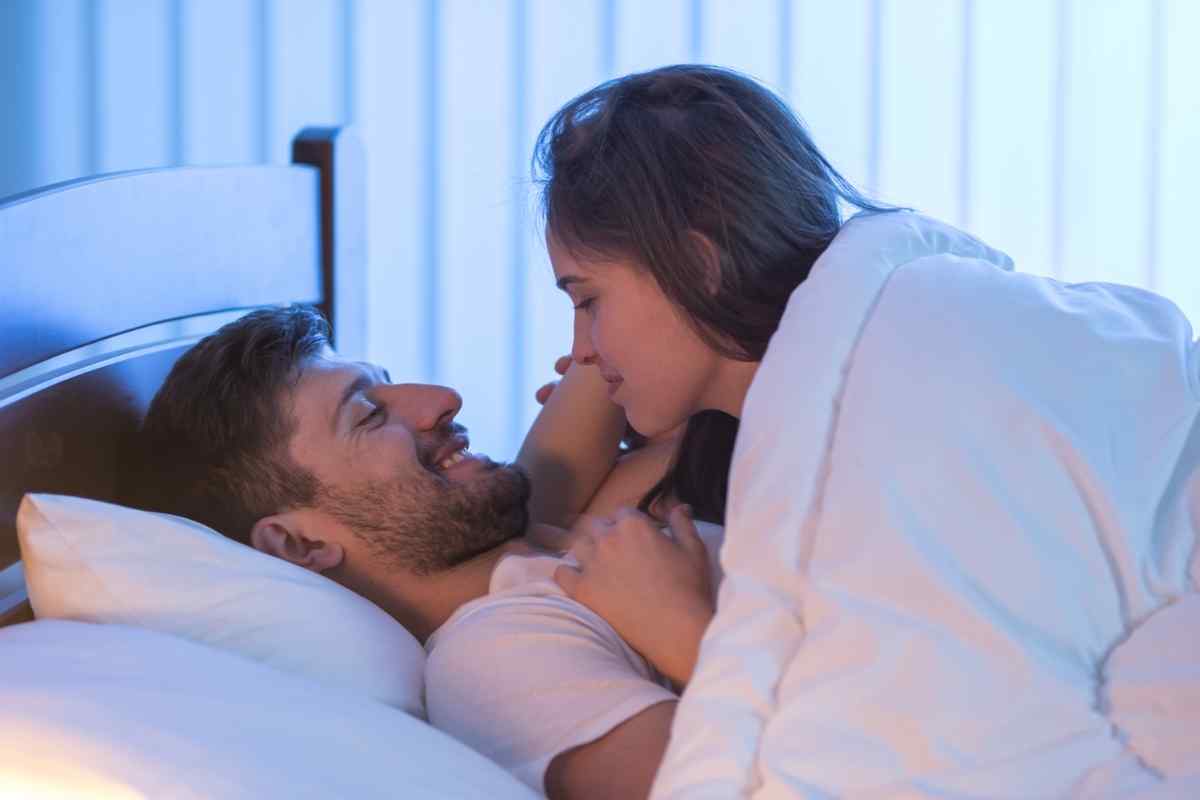 A couple in a warm, sensory-rich moment of intimacy