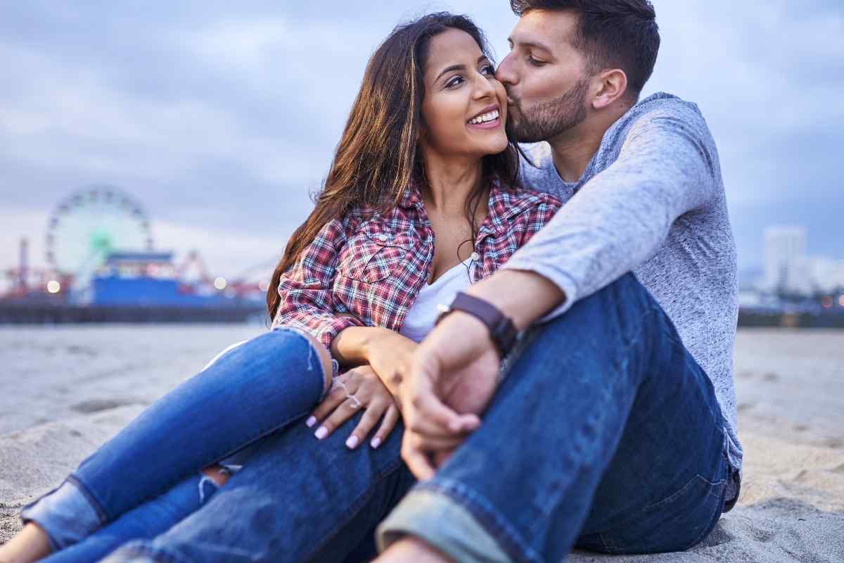 Couple having a serious conversation on a couch, listening to each other
