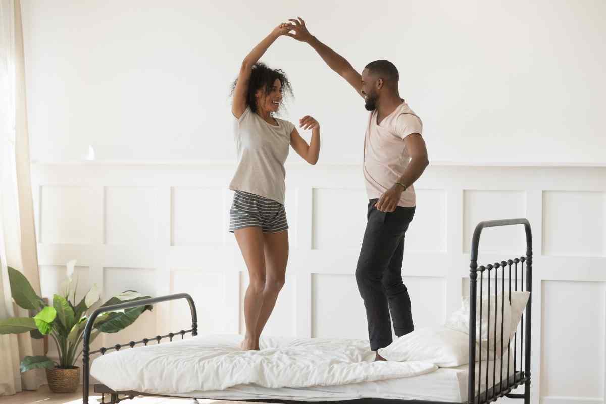 An Aquarius man and his partner in a relaxed, playful moment of genuine connection