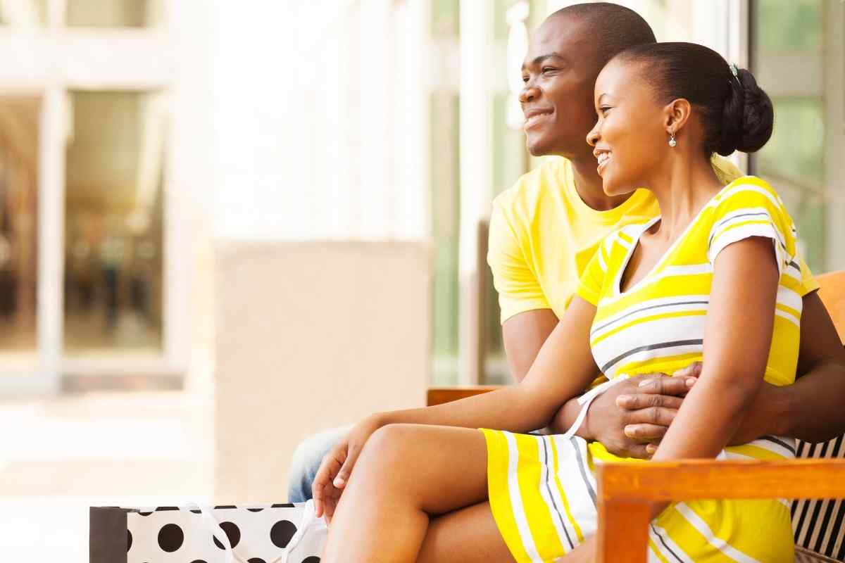 A couple on a slow evening walk through a garden, relaxed and close