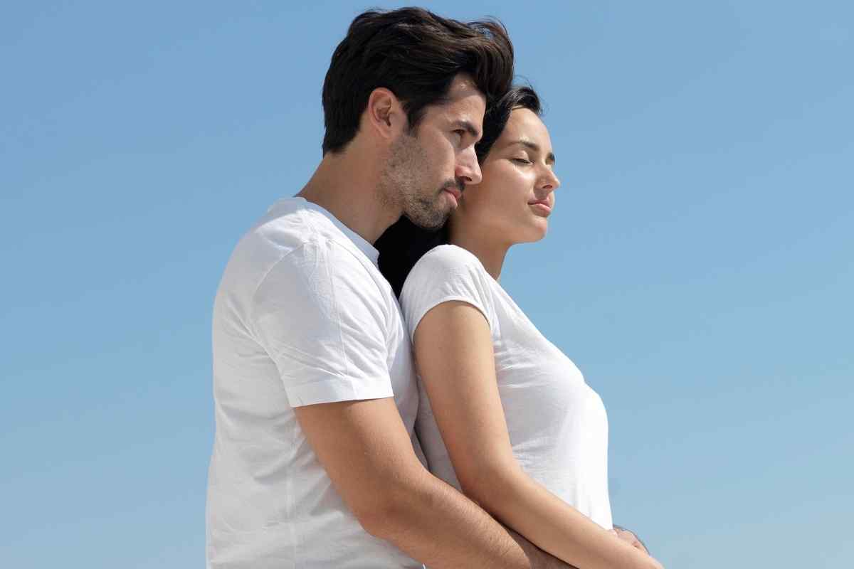 A couple having a direct, tense conversation standing face to face