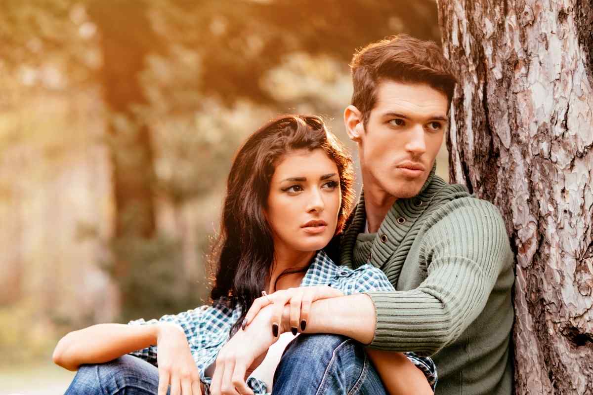 A woman looking restless and distracted while sitting with her partner