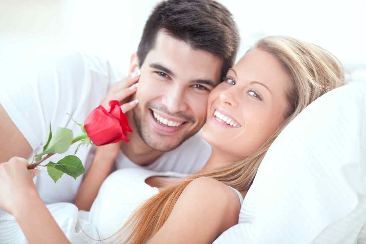 Man and woman in a warm, domestic interior setting, sharing a relaxed and comfortable moment