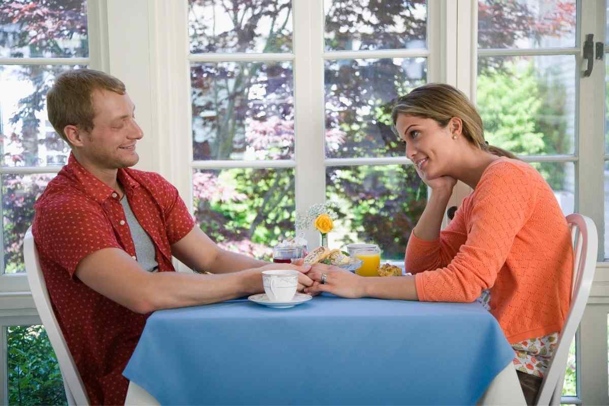 Couple sitting in silence with emotional distance between them, illustrating the signs of withdrawal in a Pisces man who has disengaged from the relationship