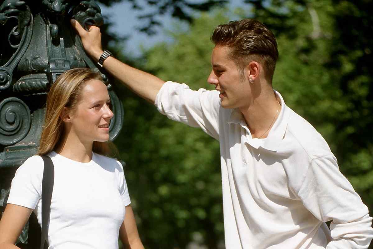 Couple sitting apart with a sense of quiet distance, illustrating the emotional withdrawal that signals a Pisces woman has disengaged from the relationship