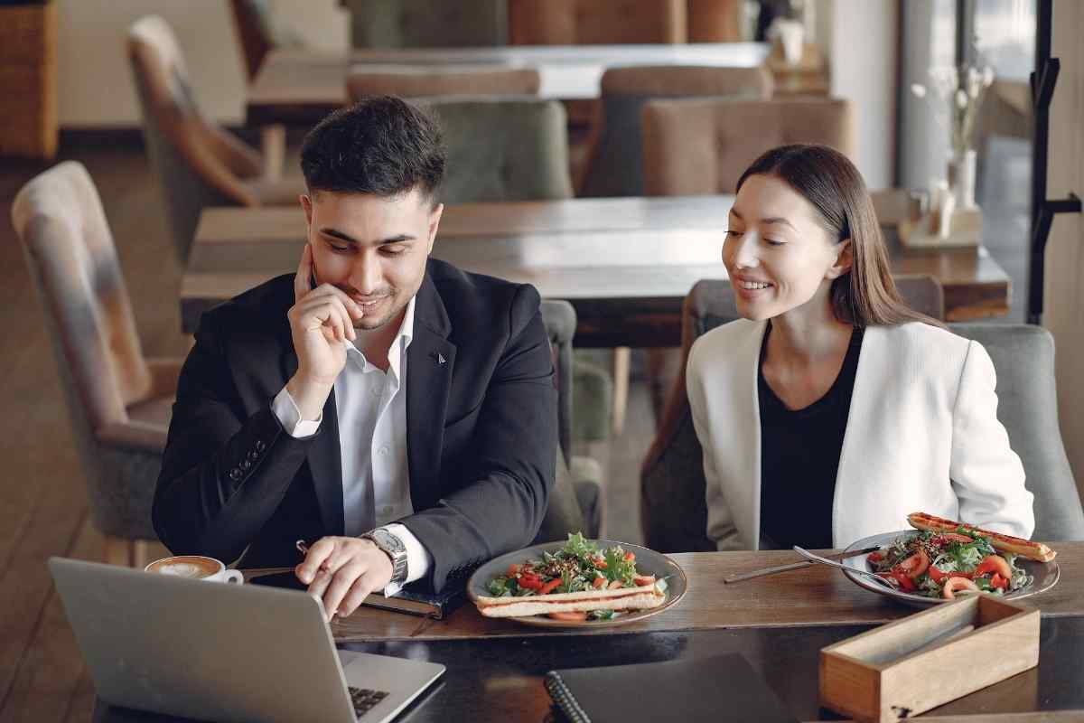 Two people resolving tension with a calm, warm conversation