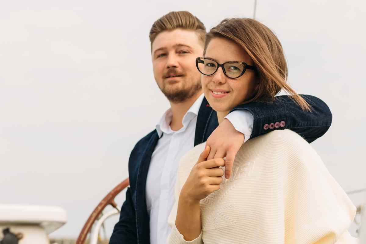 Couple sitting together on a couch having a direct, honest conversation