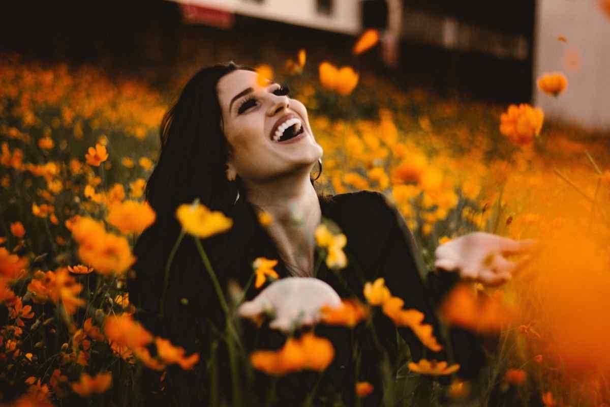 A Scorpio woman with a thoughtful, knowing expression representing her depth and insight