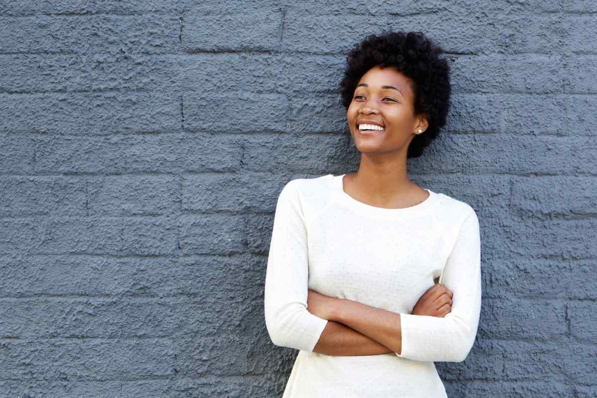 A woman at home, quiet and composed, giving herself space to sort through her feelings before responding