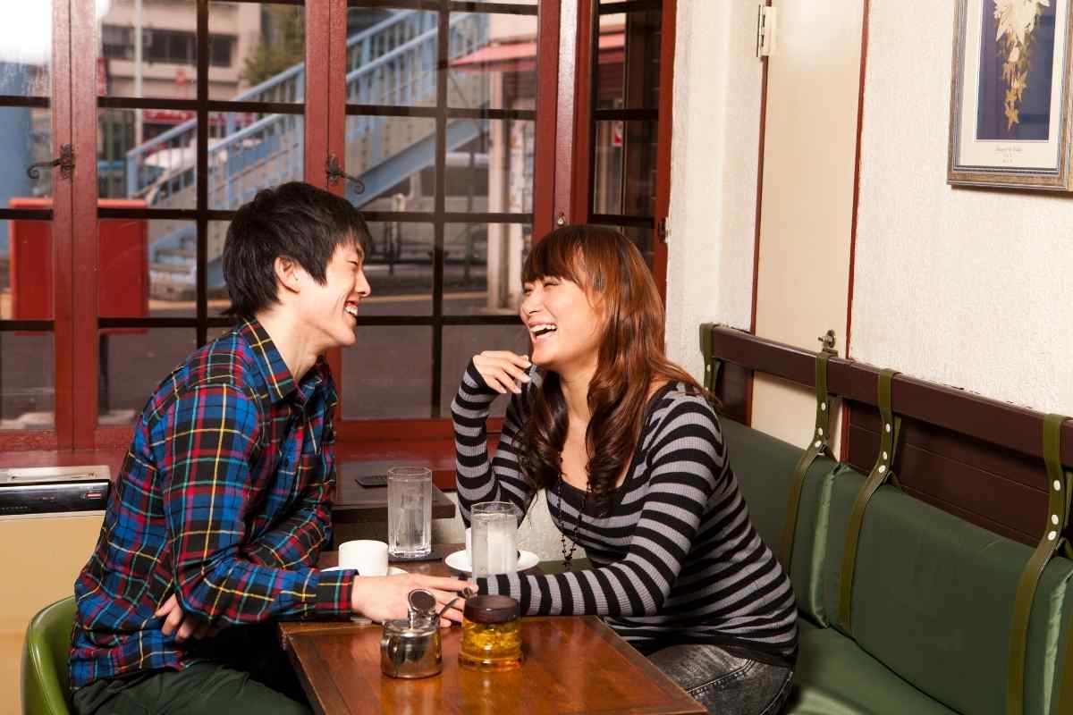 Two people reconnecting calmly in a relaxed outdoor setting