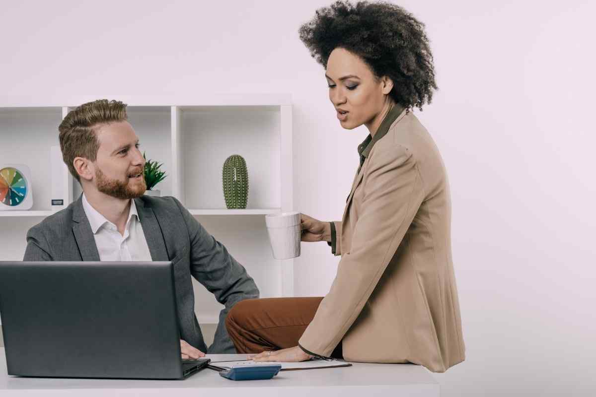 Man and woman seated across from each other, both calm and engaged in a careful, honest conversation