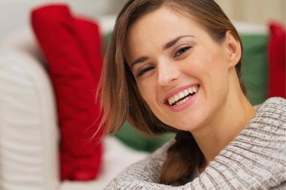 Woman sitting with a cup of tea, settled and thinking carefully before she speaks