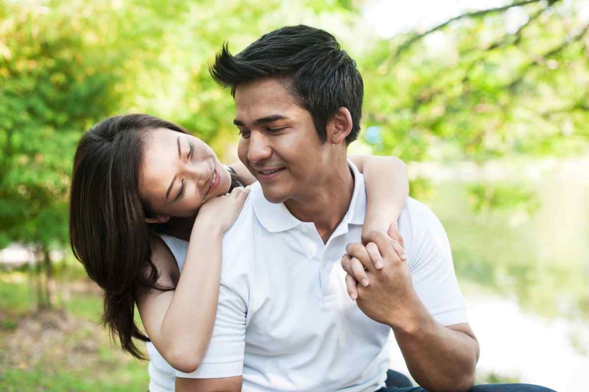 Two people sitting across from each other in a relaxed conversation, both calm and present