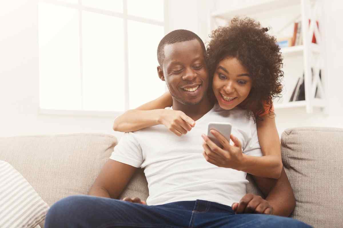 A couple sharing genuine warmth and focus on each other, reflecting the direct appreciation and real energy a Leo woman responds to