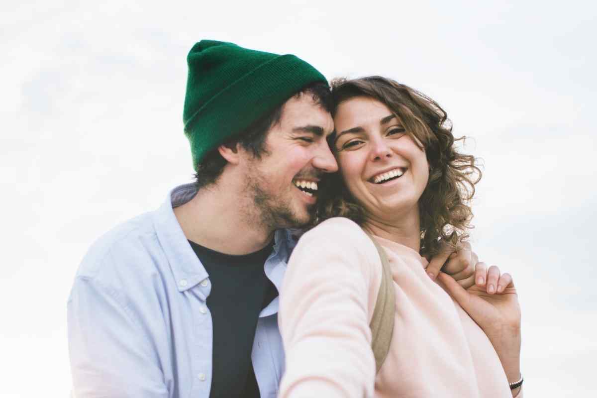 Couple connecting meaningfully over a phone call, representing the intentional communication that sustains long-distance relationships with a Pisces woman
