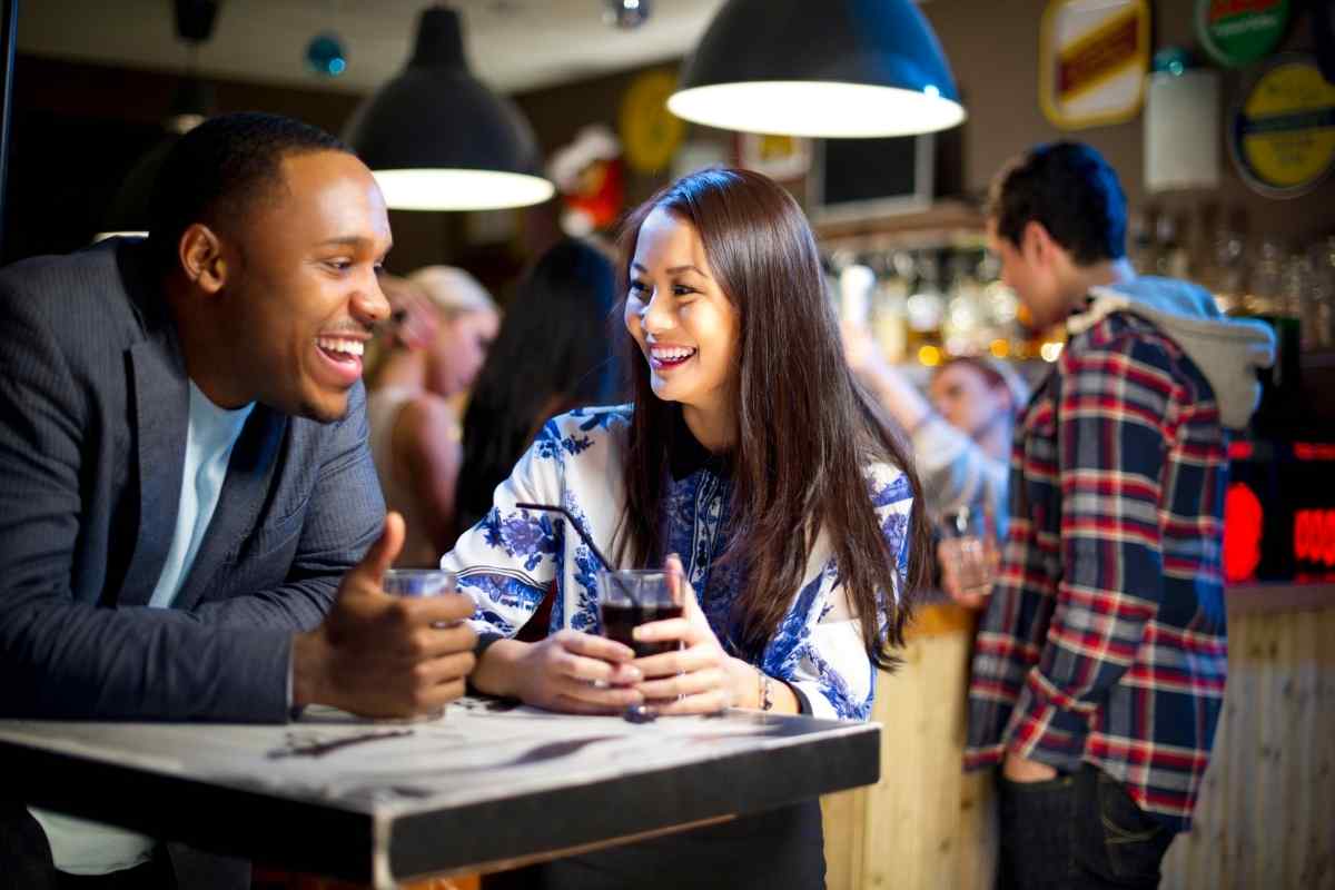 A couple in genuine, relaxed connection representing the balanced partnership and honest exchange a Libra woman seeks