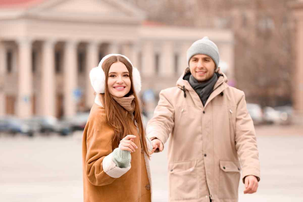 Two people in an energetic, engaged exchange representing the genuine intellectual and adventurous connection that keeps a Sagittarius man involved
