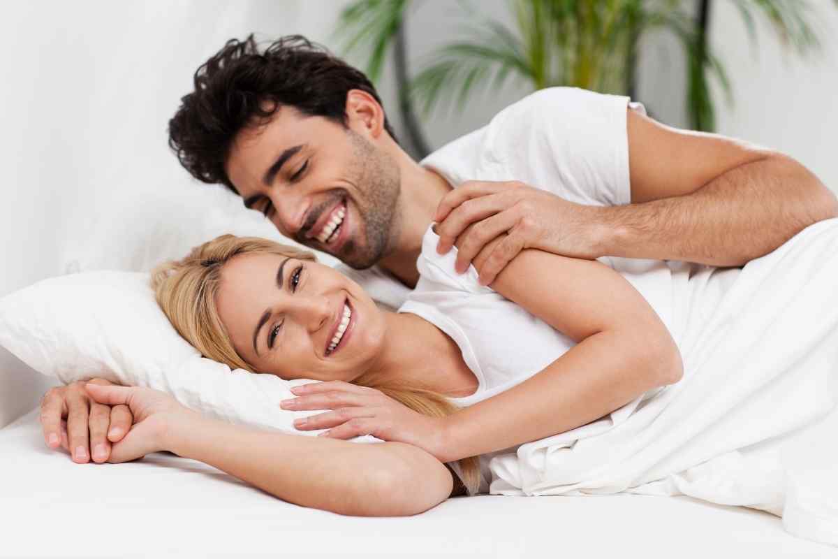 A relaxed couple sharing a comfortable, connected moment, both genuinely engaged with each other