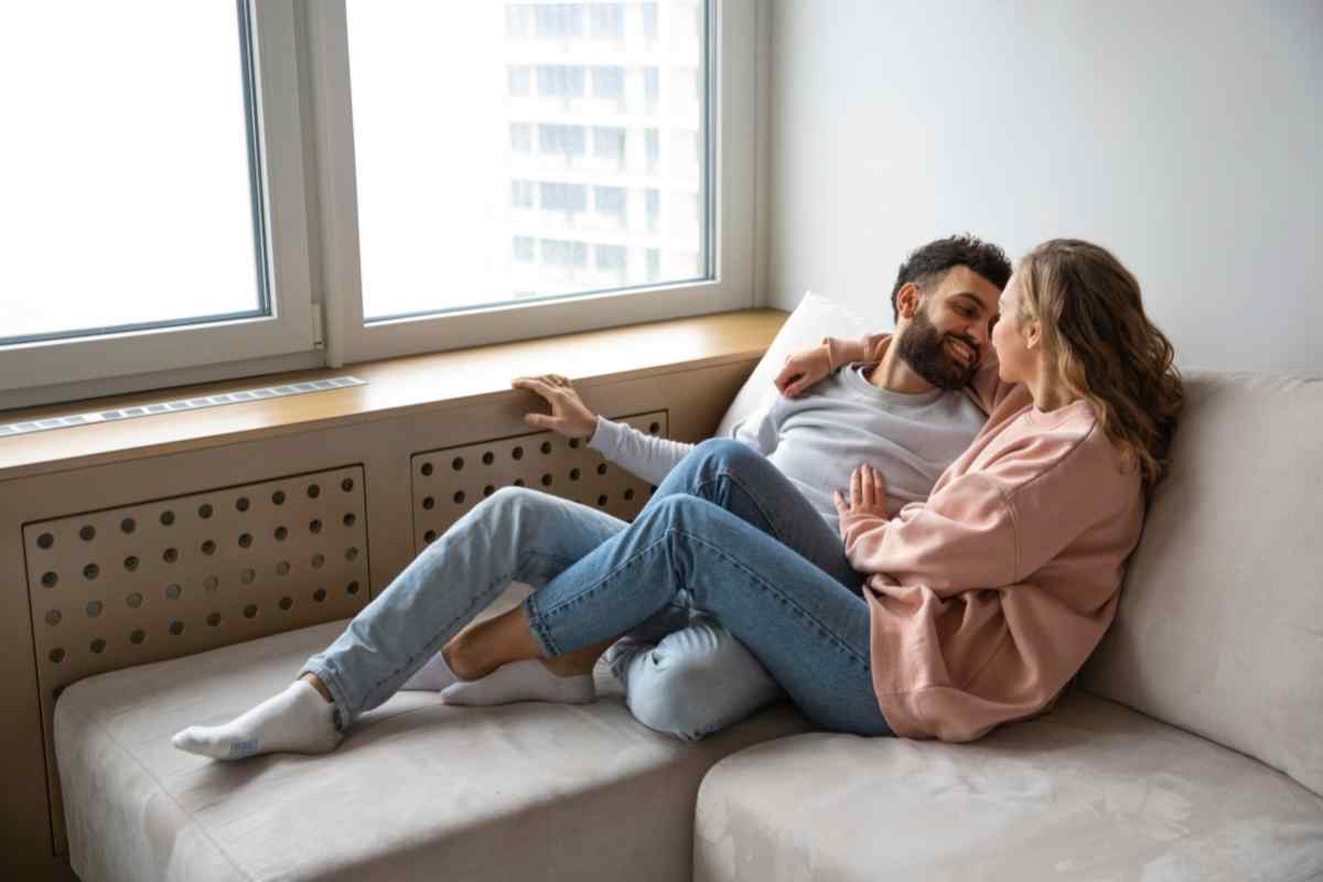 A couple relaxed and warm together, focused on each other in a comfortable, easy way