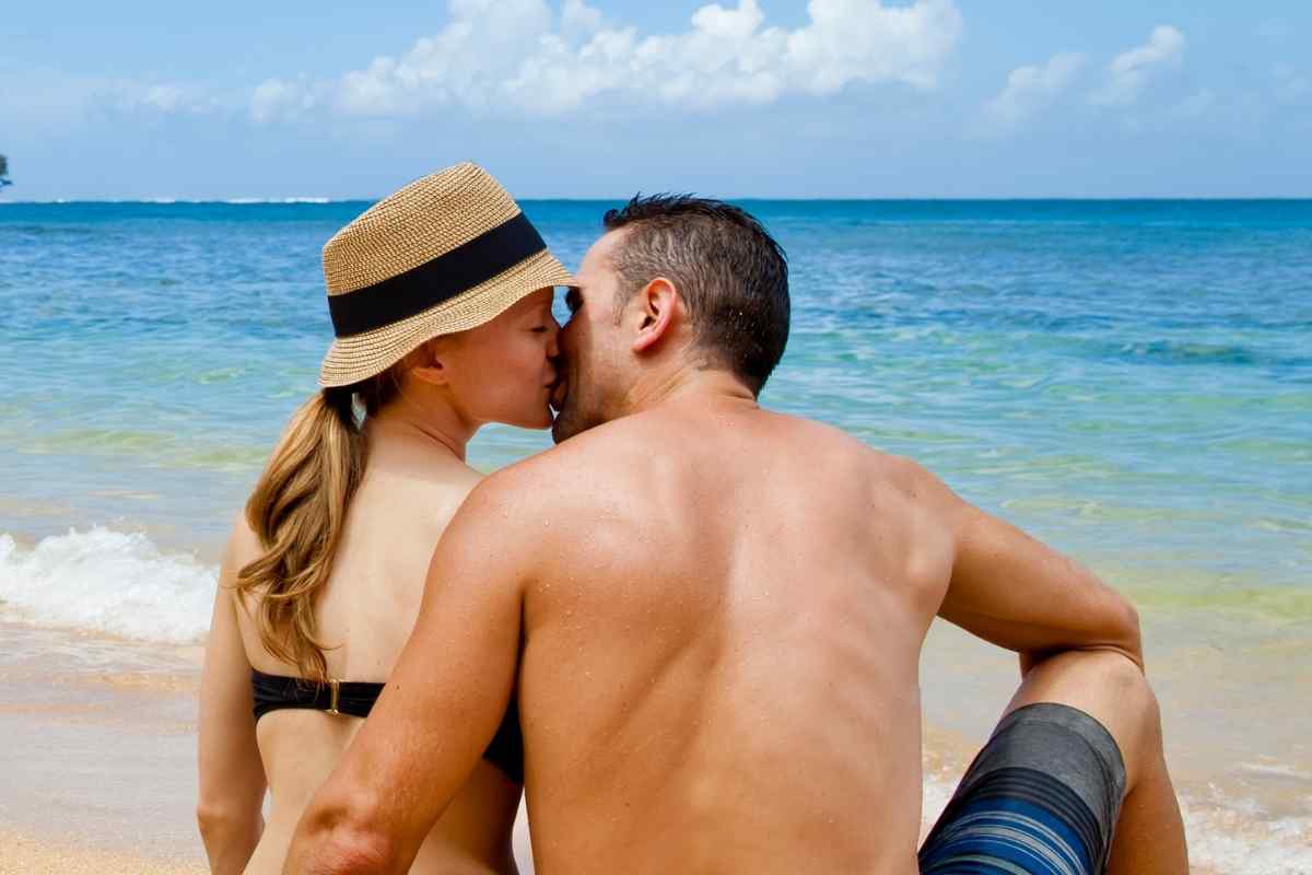 A man and woman in a quiet, warmly lit room sharing a close, unhurried moment