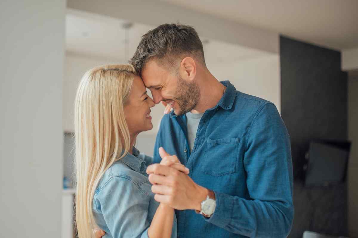 A couple in a close, intimate moment, the atmosphere calm and charged with quiet intensity