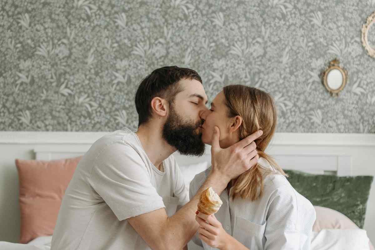 A couple in a quiet, connected moment, both genuinely relaxed and present with each other