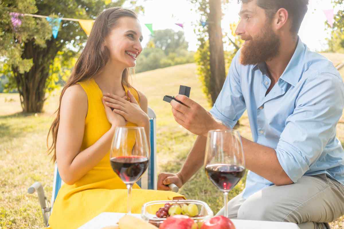 A couple facing each other with focused, direct expressions, clearly engaged with each other