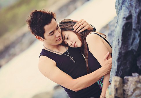 A woman looking away with a guarded expression, suggesting deliberate emotional distance