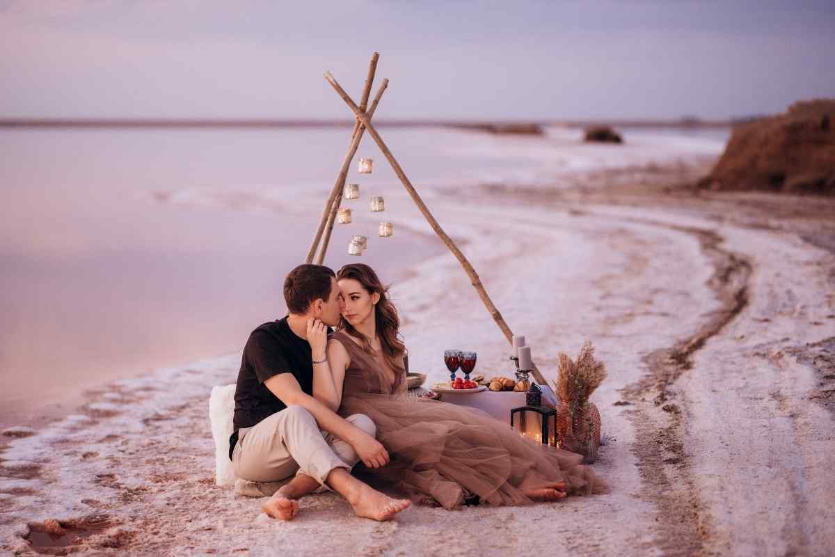 A couple sitting across from each other with visible emotional distance, neither making eye contact
