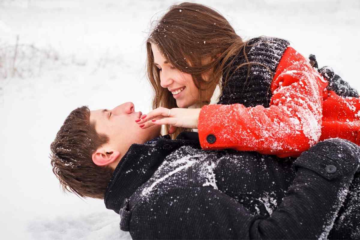 A couple sharing a spontaneous, genuine kiss with visible chemistry