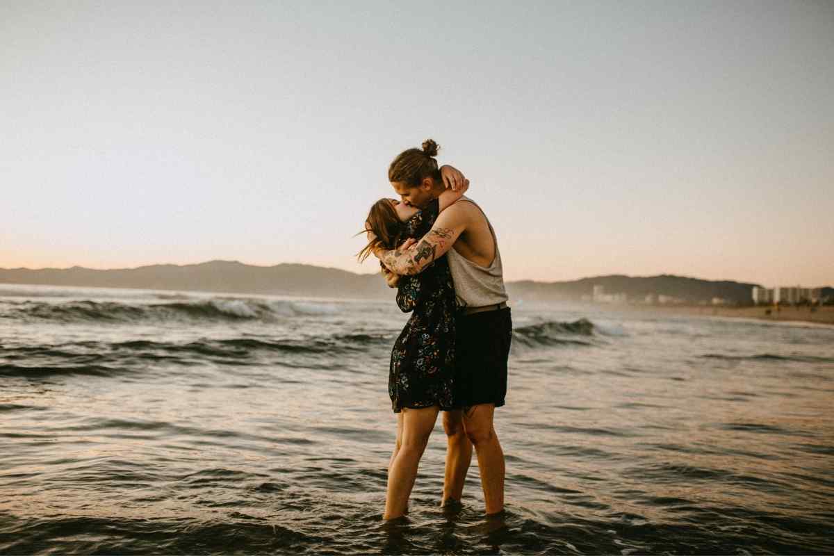 An intimate moment between partners, with warmth and playful energy