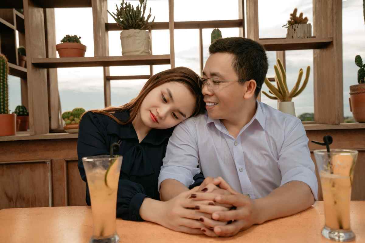 A couple sharing a warm, attentive moment on a first date