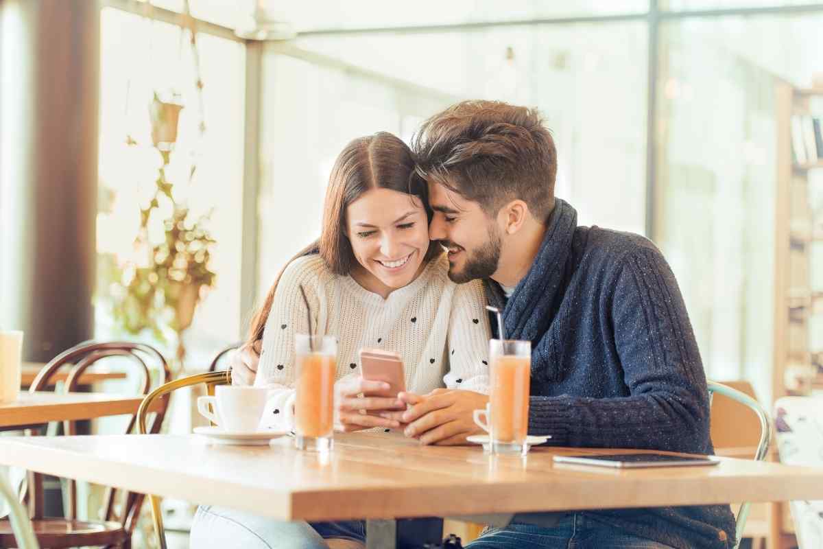 A couple enjoying a quiet, intimate conversation on a first date