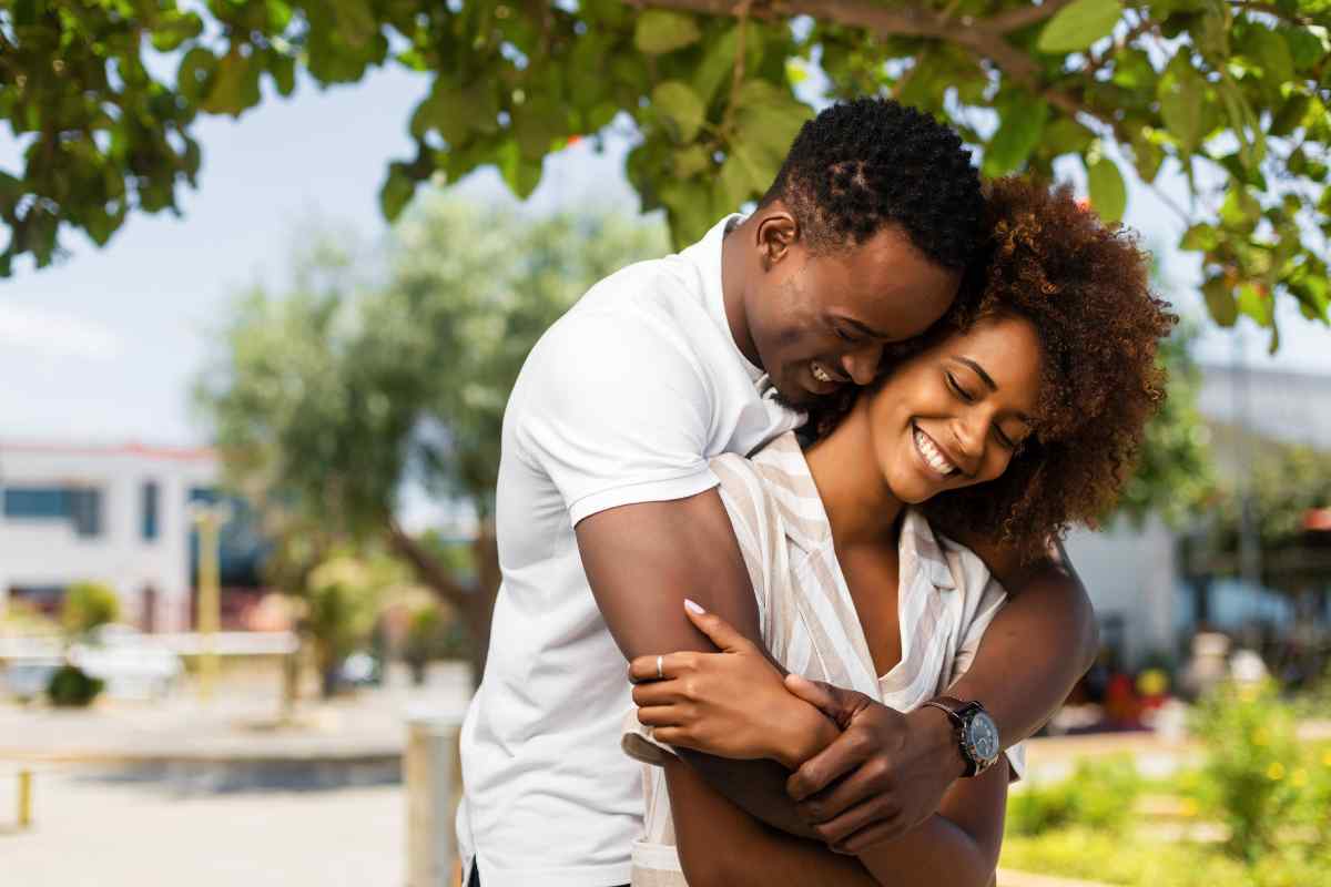 Couple exploring an outdoor market together on a sunny afternoon