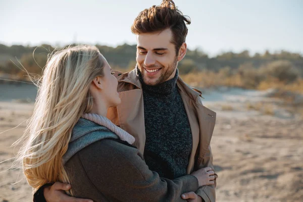 Couple laughing while playing a casual game together on a first date
